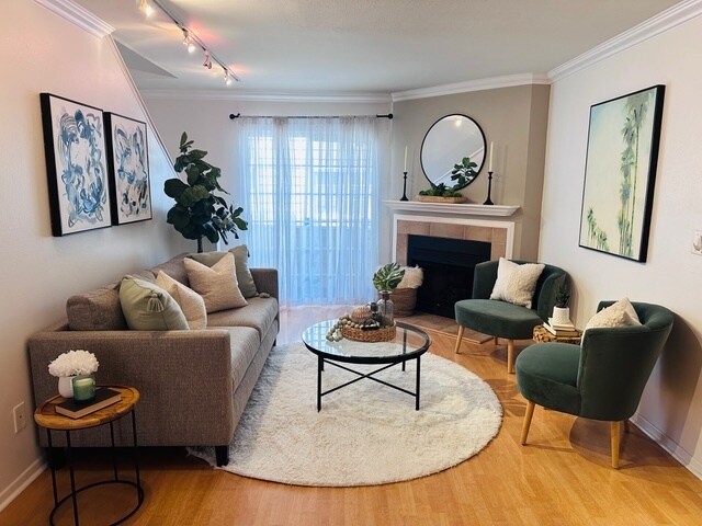 Living area with fireplace and access to 1 of 2 patios - 2474 S Centinela Ave