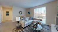 Located at 600 North Beach on Atlantic Avenue in Atlantic City, NJ, this well-appointed single-floor residence offers a thoughtfully designed open-concept layout that seamlessly connects the kitchen, dining, and living areas. The kitchen is outfitted with stainless steel appliances, including a refrigerator, range, and microwave, complemented by sleek dark cabinetry, white upper cabinets, a mosaic tile backsplash, and a light quartz countertop island. Light wood-style flooring flows throughout the main living spaces, enhancing the bright and airy atmosphere. The living room features a large sliding glass door that floods the space with natural light and provides outdoor views. The dining area comfortably accommodates a full table and chairs. The residence includes multiple bedrooms, each carpeted and furnished with windows that invite natural light. The primary bedroom offers generous proportions and closet space. Two full bathrooms each feature a soaking tub with shower, warm wood vanity cabinetry, white countertops, and tile flooring, maintaining a clean and contemporary aesthetic throughout. The overall design is modern and neutral, creating a comfortable and functional living environment steps from the Atlantic City beachfront.