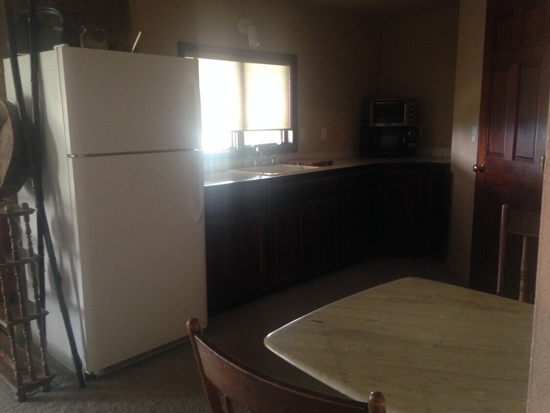 Fridge and counterspace from livingroom. - 3003 W Horizon Ave