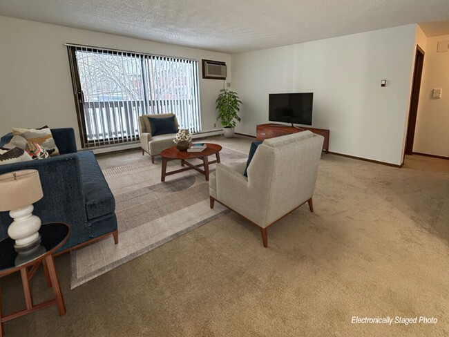 Living Room with Large Sliding Glass Door - THE LEGACY