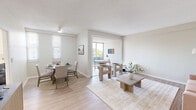 Located at 216 Fountain Street in New Haven, CT, this thoughtfully designed 2-bedroom, 2-bathroom residence offers a bright and airy atmosphere throughout. Light hardwood-style flooring flows through the main living areas, complemented by a neutral color palette that enhances the sense of openness. The combined living and dining area is generously proportioned, featuring a ceiling fan, multiple windows that invite natural light, and a seamless connection to a private balcony — ideal for enjoying outdoor views. A subtle step detail adds architectural interest to the living space. The kitchen is well-appointed with white shaker cabinetry, stainless steel appliances including a range, microwave, dishwasher, and refrigerator, along with a pendant light and a window above the sink. The spacious primary bedroom is carpeted and bathed in natural light, offering a serene retreat. The second bedroom, also carpeted, provides flexible use with ample room. Both bathrooms are finished in crisp white with modern vanities and tiled flooring. Additional highlights include two dedicated office spaces, in-unit laundry, and an impressive seven closets for abundant storage. The overall ambiance is clean, modern, and move-in ready.