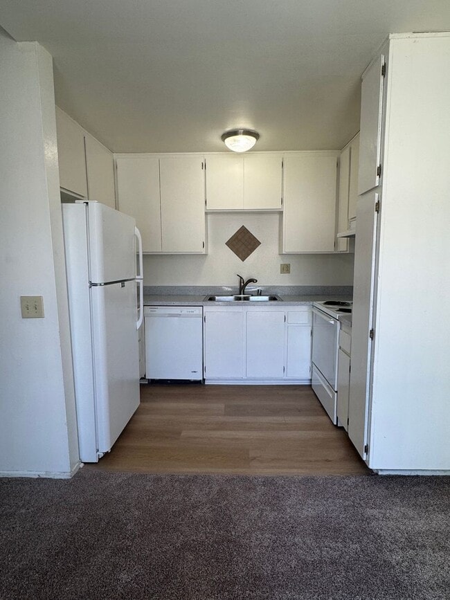 Building Photo - Upstairs two-bedroom 1/12 bath condo avail...