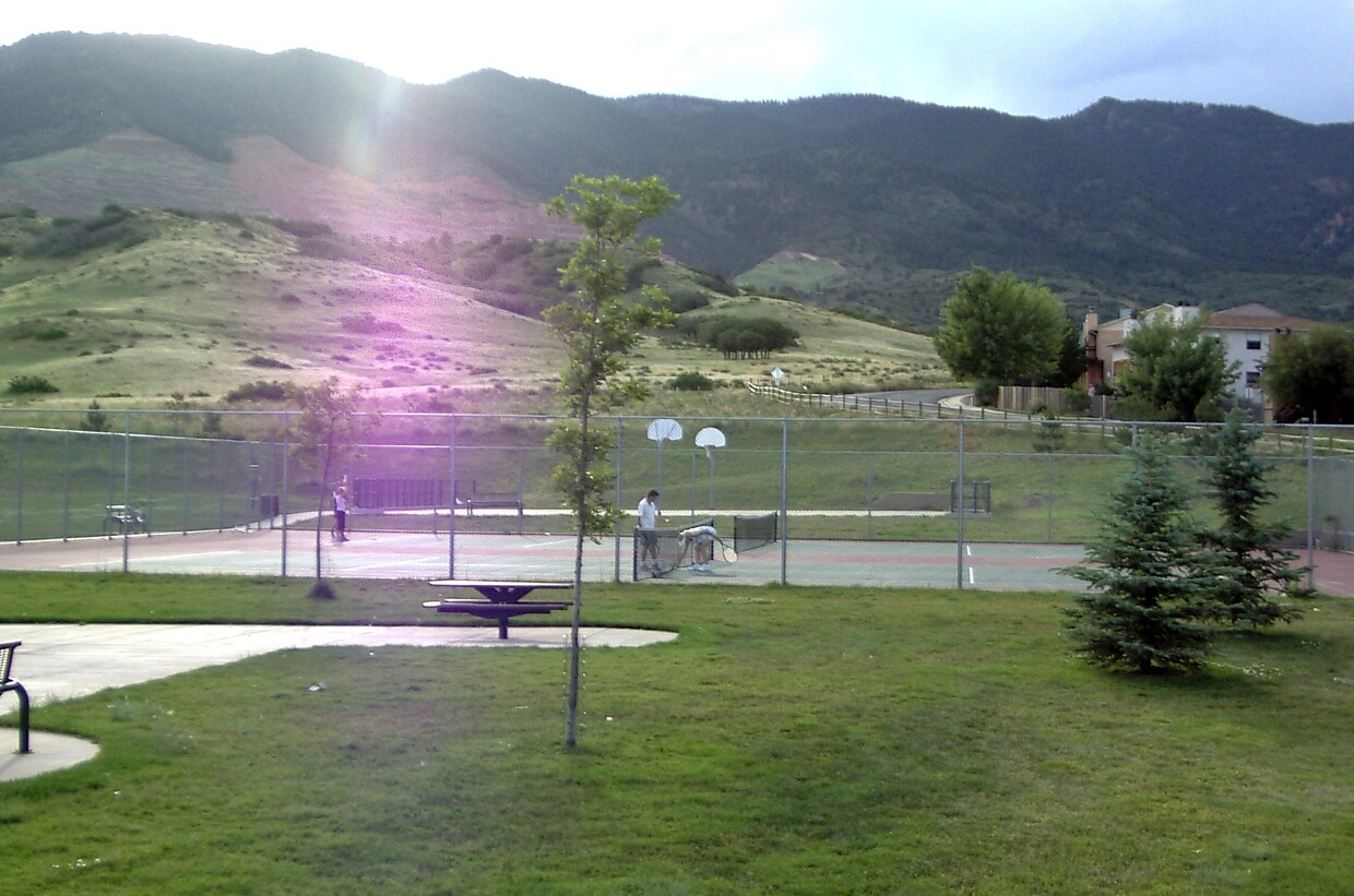 Tennis and basketball courts at Wilson Ranch Park very near the mountains; looking west. - 2247 Split Rock Dr