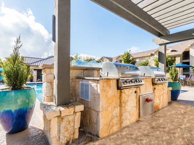 Entertain poolside with an outdoor grilling area and dine al fresco - Alister Oak Hill