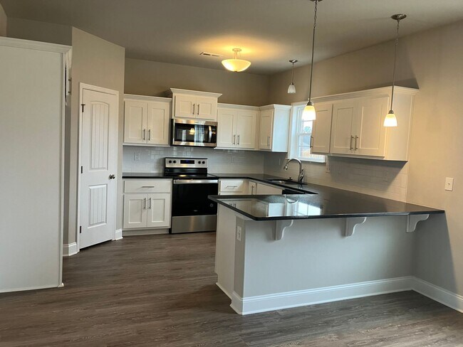 Building Photo - Welcome to this spacious 4-bedroom, 2.5-ba...