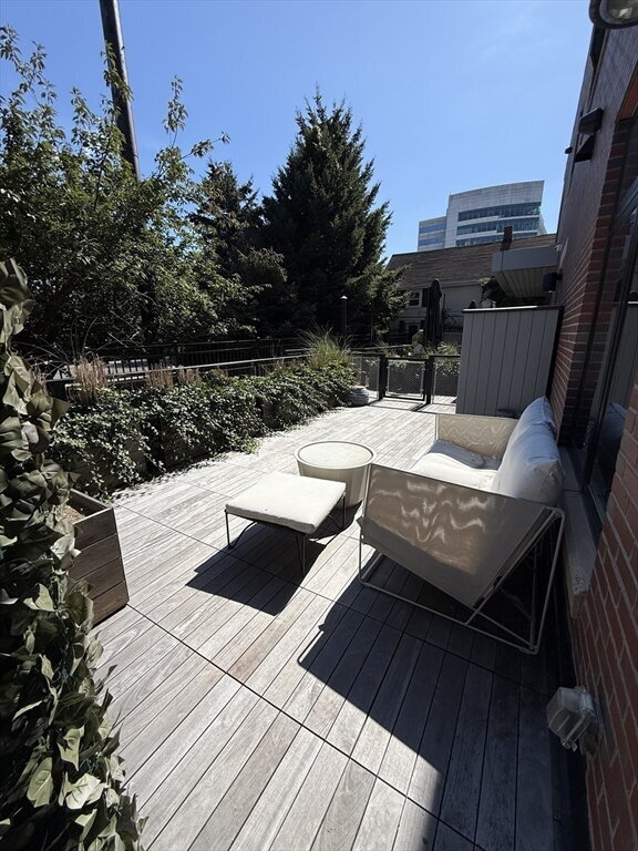 Photo - "Charming 1-Bed Boston Retreat with Granite Touches, Cozy Fireplace & Hardwood Elegance!" Apartment