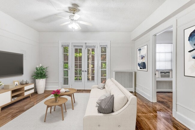 One-bedroom apartment living area (virtually staged) - Highview and Castle Manor Apartments