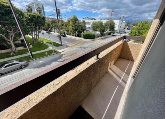 master bedroom balcony facing hte street - 14572 Dickens St