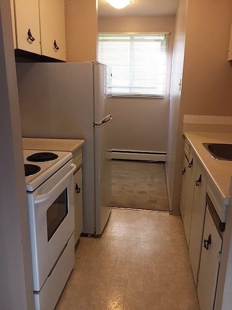 Building Photo - Cozy 1-Bedroom Apartment in Quiet Bankview Neighborhood