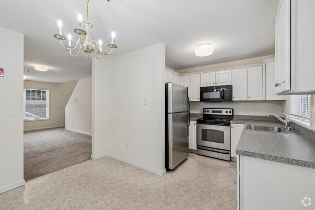 1BR, 1.5BA -714SF - Kitchen - Orchard Place