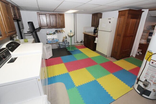 Laundry room including washer/dryer and extra fridge - 572 Kent Cir