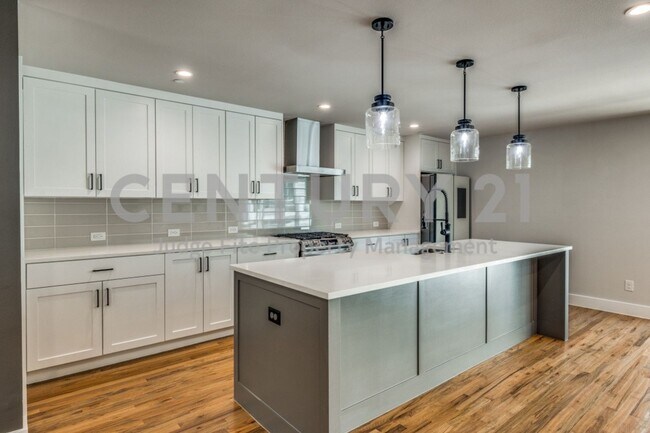 Building Photo - One-Of-A-Kind 4-Story 2/2.5.5/2 Townhome R...