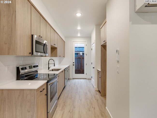 Building Photo - Modern 2-Bed, 1.5-Bath Condo with Custom K...