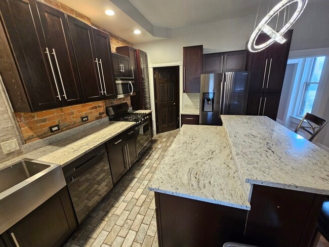 Beautiful marble countertops, modern coffee cabinets - 943 Highland St