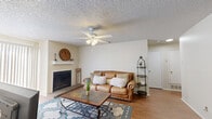 Located at 3201 W Loop 289 Frontage Rd in Lubbock, TX, this one-bedroom, one-bathroom residence offers a well-organized single-floor layout with a comfortable and functional design. The living room serves as the heart of the home, featuring hardwood-style flooring, a textured ceiling, a ceiling fan with light, and a charming brick fireplace that adds warmth and character to the space. The galley-style kitchen is efficiently designed with dark wood cabinetry, white countertops, and black appliances including a refrigerator, dishwasher, stove, and built-in microwave, providing ample storage and workspace. The spacious bedroom is carpeted for comfort and includes a ceiling fan, a closet, and a window that invites natural light into the room. The full bathroom is well-appointed with a tub and shower combination, dark wood cabinetry, a vanity with a light countertop, and hardwood-style flooring that ties the space together. Throughout the unit, neutral wall tones create a clean and inviting atmosphere, while the consistent flooring in main areas contributes to a cohesive aesthetic. This thoughtfully laid-out residence offers practical living in a convenient Lubbock location.