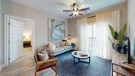 Located at 1139 Bragg Way in Myrtle Beach, SC, this well-appointed single-floor residence offers a thoughtfully designed open-concept layout with modern finishes throughout. The living area is bright and welcoming, featuring wood-look flooring, a ceiling fan, and large sliding glass doors that open to a private balcony, filling the space with natural light. The kitchen is outfitted with stainless steel appliances, white cabinetry, granite countertops, and a peninsula island with pendant lighting — ideal for both cooking and casual dining. Each bedroom is carpeted for comfort and includes a ceiling fan, generous closet space, and windows with blinds allowing for natural light and privacy. The primary bedroom features a walk-in closet with wire shelving. The bathrooms are finished with granite-top vanities, wood-look flooring, and clean, contemporary fixtures; one bath includes a glass-enclosed shower. Neutral tones and clean lines are consistent throughout the unit, creating a cohesive and modern aesthetic. The open floor plan ensures a smooth flow between the kitchen, dining, and living areas, making the space feel connected and functional. This residence combines practical design with contemporary style in a prime Myrtle Beach location.