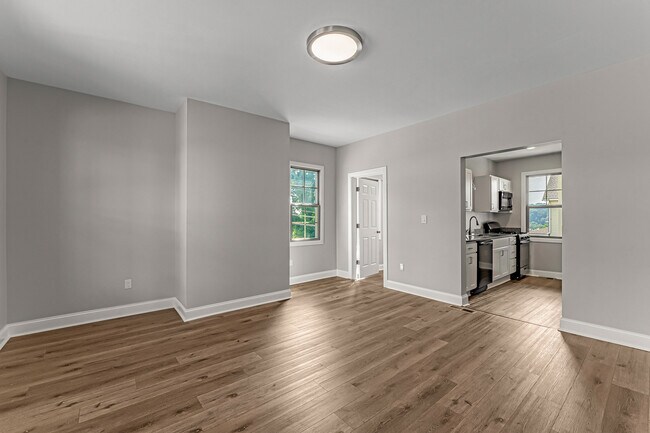 First floor living room featuring new hardwood floors! - 101 W 10th Ave