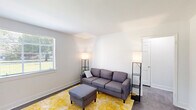 Located at 2343 Memorial Ave SW in Roanoke, VA, this well-appointed one-bedroom, one-bathroom unit offers a thoughtfully organized single-floor layout. The living room greets you with clean white walls, dark flooring, and natural light streaming through a window fitted with blinds, creating a bright and welcoming atmosphere. A separate dining area, also bathed in natural light from its own window, provides a defined space for meals. The kitchen is outfitted with white cabinetry, marble-style countertops, a stainless steel range with hood, and a glass-panel exterior door that brings in additional daylight. The bedroom features a window overlooking the surrounding neighborhood, soft carpeted flooring, and two closets for ample storage. The bathroom is finished with classic mosaic tile flooring, a clean white vanity with mirror, and a shower-tub combination, with a window adding natural ventilation. A connecting hallway ties all rooms together efficiently. Throughout, the unit maintains a neutral, light-toned palette that contributes to an open, clean aesthetic suitable for comfortable everyday living.