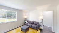 Located at 2343 Memorial Ave SW in Roanoke, VA, this well-appointed one-bedroom, one-bathroom unit offers a thoughtfully organized single-floor layout. The living room greets you with clean white walls, dark flooring, and natural light streaming through a window fitted with blinds, creating a bright and welcoming atmosphere. A separate dining area, also bathed in natural light from its own window, provides a defined space for meals. The kitchen is outfitted with white cabinetry, marble-style countertops, a stainless steel range with hood, and a glass-panel exterior door that brings in additional daylight. The bedroom features a window overlooking the surrounding neighborhood, soft carpeted flooring, and two closets for ample storage. The bathroom is finished with classic mosaic tile flooring, a clean white vanity with mirror, and a shower-tub combination, with a window adding natural ventilation. A connecting hallway ties all rooms together efficiently. Throughout, the unit maintains a neutral, light-toned palette that contributes to an open, clean aesthetic suitable for comfortable everyday living.