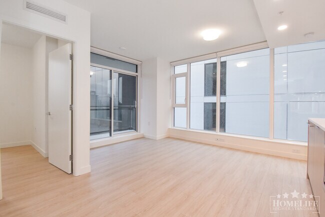 Photo du bâtiment - Stunning 1 Bed 1 Bath + Den Condo for Rent in Surrey City Centre's Modern Flamingo Building!