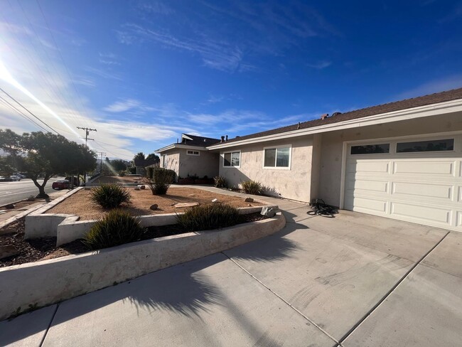 Building Photo - UPDATED 4br/2ba HOME w/ attached GARAGE in...