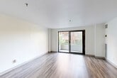 This well-appointed 2-bedroom, 2-bathroom residence at 36 Dartmouth Street in Malden, MA offers a thoughtfully designed single-floor layout with a clean, modern aesthetic. Wood-style flooring flows consistently throughout, complementing the bright white walls and creating a cohesive, contemporary feel.

The combined dining and living area is generously sized, bathed in natural light, and opens directly onto a private balcony through large sliding glass doors — ideal for enjoying outdoor views of the surrounding neighborhood. The kitchen is outfitted with granite countertops, sage-toned cabinetry, stainless steel appliances including a refrigerator and dishwasher, and a double sink, offering both style and functionality.

The spacious primary bedroom features direct access to a large walk-in closet with wire shelving, providing ample organization options. The second bedroom is bright and well-proportioned, featuring a wide double-door closet and a window with natural light. In total, five closets are distributed throughout the unit, ensuring exceptional storage capacity.

Both bathrooms are finished with tile flooring and clean white fixtures. One bathroom includes a walk-in shower with sliding glass doors and granite-topped vanity. A dedicated entrance and hallway provide a smooth transition into the main living areas, rounding out a well-organized and functional floor plan.