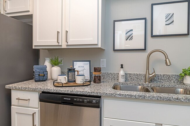 Kitchen with granite counters and modern cabinetry - Reserve at Drakes Creek