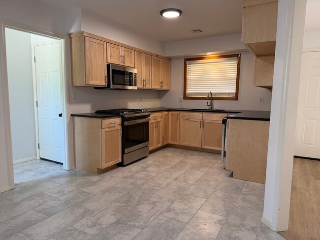 Building Photo - 1509 S 67th E Ave