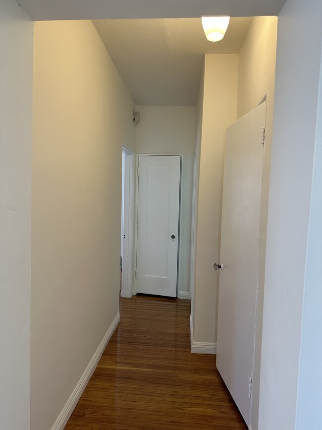 Hallway going to bedroom (L) and bathroom (R) - 157 W Channel Rd