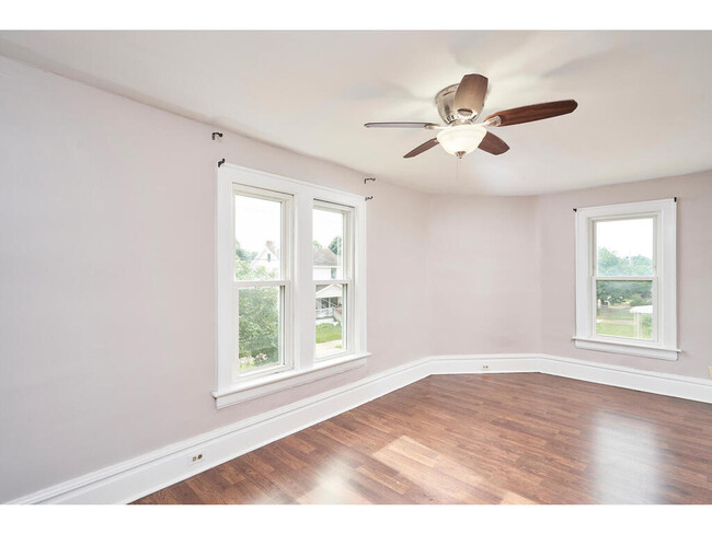 Beautiful Master bedroom with curved wall, freshly painted, and newer wood flooring. - 1214 Beardsley St