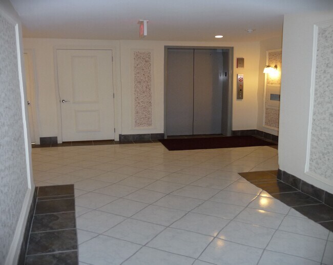 elevator behind foyer - 5200 Carriageway Dr