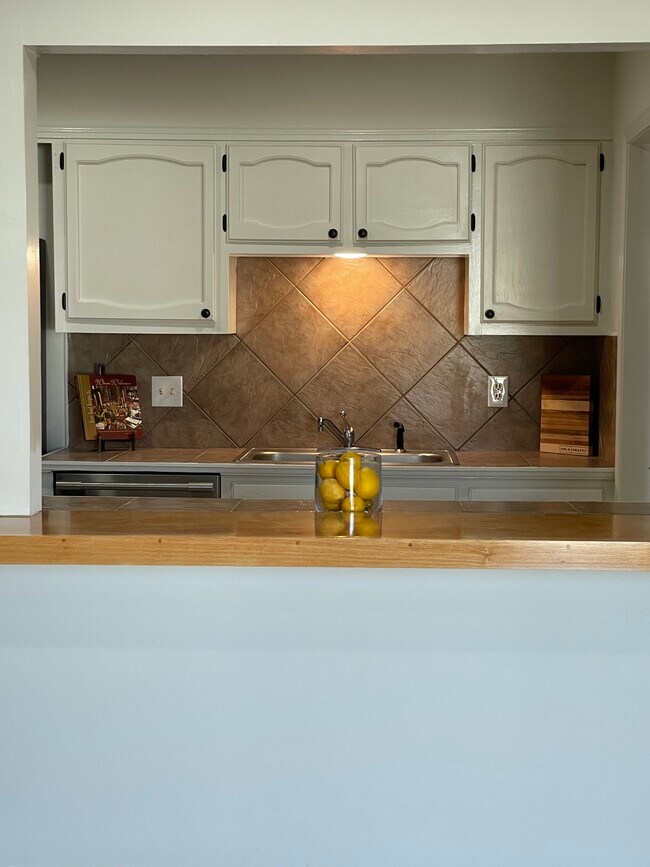 View of kitchen from dining room - 12447 Coursey Blvd