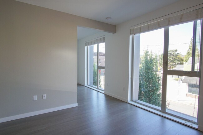 Foto del edificio - Modern & Sleek 1Bdr w/Floor-to-Ceiling Win...