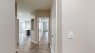 Embrace the pinnacle of contemporary living in this exquisite 2-bedroom, 3-bathroom apartment at The Quarters at Towson Town Center. This 1,290 square foot haven is a testament to modern design and comfort, offering a lifestyle that's both luxurious and practical.

Step into the heart of the home - a breathtaking open-concept kitchen and living area. The kitchen is a culinary enthusiast's dream, boasting sleek grey cabinetry, state-of-the-art stainless steel appliances, and an expansive quartz island that's perfect for both meal prep and casual dining. The adjoining living room, bathed in natural light from large windows, provides an ideal space for relaxation and entertaining.

The bedrooms are sanctuaries of tranquility, with the primary suite offering a generous 200 square feet of personal space. Each of the three bathrooms is a showcase of modern elegance, featuring stylish fixtures and ample storage.

Throughout the apartment, you'll find premium vinyl plank flooring that marries durability with sophistication. The neutral color palette creates a canvas for your personal style, while the abundance of natural light enhances the sense of space and serenity.

A unique feature is the curved wall of windows in one of the living areas, offering panoramic views and creating a stunning architectural focal point. This space is perfect for a home office, reading nook, or additional entertaining area.

Live the life you've always dreamed of at The Quarters - where luxury, comfort, and convenience converge to create your perfect home.