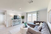 Located at 16625 Poe Ave in Baton Rouge, Louisiana, this single-story home offers four bedrooms and three bathrooms within a thoughtfully designed floor plan. Light wood-look flooring flows throughout, complementing the bright, neutral palette that defines the interior.

The open-concept living, dining, and kitchen area serves as the heart of the home. The living room features large windows that invite natural light and offer views of the fenced yard. The kitchen stands out with crisp white cabinetry, granite countertops, stainless steel appliances, and a central island with bar seating — ideal for both everyday meals and entertaining. An adjacent dining area provides a dedicated space for gatherings.

The well-lit hallways connect the bedrooms with ease, with the generously sized primary bedroom offering a spacious walk-in closet. Additional bedrooms are comfortably sized, each with closet access. The home includes three full bathrooms, each finished with granite vanities and clean, white fixtures. A dedicated laundry room houses a full-size washer and dryer. The attached garage provides ample space for vehicles and storage. A patio and pantry round out the functional layout of this move-in-ready Baton Rouge home.