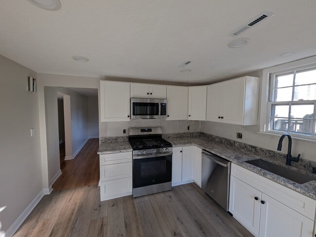 Kitchen into living room. - 24 Curtis St