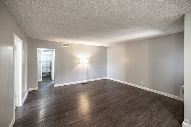 3BR, 2BA - 1,100SF - Living Room - Somerset plaza