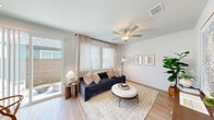 Located at 3350 College Park Dr in Round Rock, TX, this thoughtfully designed one-bedroom, one-bathroom residence offers a clean, modern aesthetic throughout its single floor. Light wood-style flooring runs continuously through the space, lending warmth and visual cohesion from entry to living area.

A welcoming hallway leads into the heart of the home, where the kitchen stands out with white shaker-style cabinetry, granite countertops, a subway tile backsplash, and a full suite of stainless steel appliances including a refrigerator, range, microwave, and dishwasher. Recessed lighting and a sliding glass door flood the kitchen with natural light, while a cozy dining nook provides space for a small table and chairs.

The living room is bright and airy, featuring multiple windows with sheer draping curtains, a ceiling fan, and a sliding door that opens to an outdoor area. The neutral palette and open layout make the space feel comfortable and inviting.

The bedroom is a serene retreat, offering a ceiling fan, a natural light window, and a double sliding-door closet with built-in shelving for ample storage. The bathroom includes a glass-enclosed shower with white subway tile and a built-in bench, finishing the space with a clean, modern touch.
