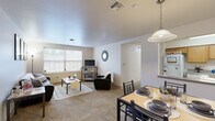 Located at 111 Honeysuckle Ct in Bloomsburg, PA, this single-floor unit offers four bedrooms, three bathrooms, and a thoughtfully arranged layout that maximizes functionality. The open-concept living and dining area serves as the heart of the home, with large windows allowing natural light to fill the carpeted space. The living room provides a comfortable gathering area, while the adjacent dining space offers easy access to the kitchen. The kitchen features warm oak cabinetry, ample counter space, and tile flooring, providing a practical and inviting cooking environment. Three full bathrooms are distributed throughout the unit, each with tile flooring and tub-shower combinations. The four bedrooms are carpeted and each includes window access to natural light, making them well-suited as private living and study spaces. Five closets are spread throughout the unit, offering generous storage options. A dedicated laundry room adds everyday convenience. A central hallway connects the bedrooms and bathrooms, contributing to a practical flow throughout the unit. The clean, neutral color palette and consistent finishes give the space a cohesive and welcoming character throughout.