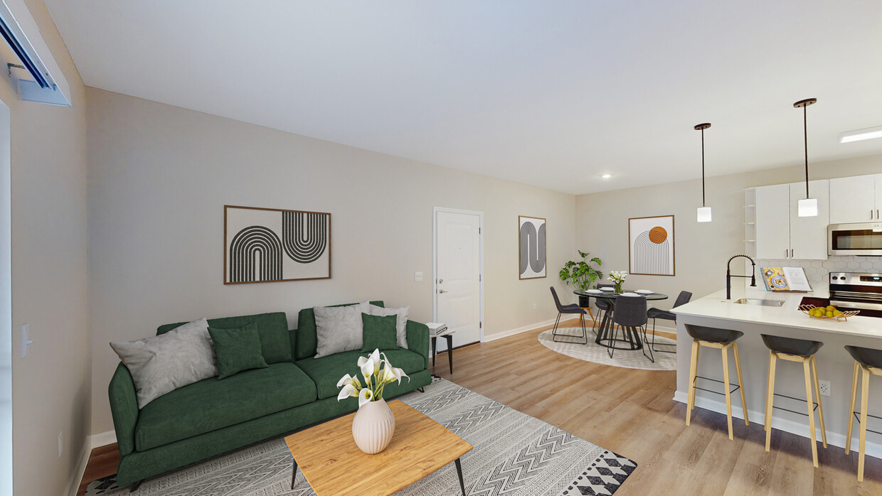 Newly Renovated Living Room with Hardwood-Style Flooring - The Chelsea Apartments