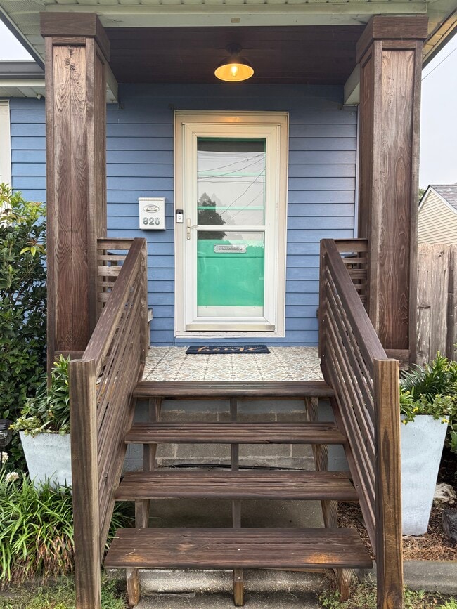 Cute front porch with seating - 820 Thirba St
