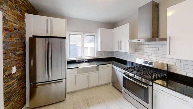 Building Photo - 9/1 No Fee! Renovated 3BR near Green Line w/balcony, free laundry