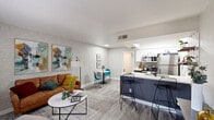 Located at 1829 E Morten Ave in Phoenix, AZ, this thoughtfully designed one-bedroom, one-bathroom unit offers a well-organized single-floor layout that maximizes every square foot. The open-concept living, dining, and kitchen area creates a seamless flow, anchored by wood-look tile flooring and neutral-toned walls accented by a textured feature wall in the living room. The kitchen is well-equipped with stainless steel appliances including a refrigerator, microwave, and range, complemented by white upper cabinetry, gray lower cabinets, crisp white countertops, a peninsula with bar seating, and decorative open shelving with patterned tile accents. A skylight adds natural brightness to the kitchen space. The dining area sits adjacent, offering an intimate setting between the kitchen and living room. The living room features a front-facing window that allows natural light to fill the space. The bedroom is comfortably sized, featuring a window with exterior views, a sliding-door closet, and wood-look flooring. Additional closet storage is available throughout the unit. The bathroom is bright and clean, finished in white with tile flooring. Three closets throughout the unit provide ample storage for everyday living.