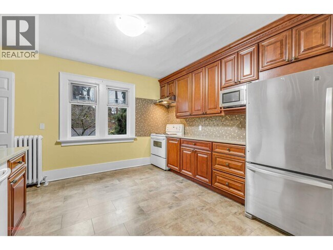 Photo du bâtiment - 1488 W 33rd Ave