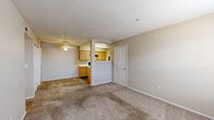 This 2-bedroom, 1-bathroom unit in Oklahoma City, OK offers a practical and well-organized single-floor layout. The open living and dining area is carpeted throughout, with neutral beige walls and a ceiling fan that enhance comfort and airflow. A window with blinds provides natural light, while two interior doors lead to additional rooms, creating a clear and connected flow through the space.

The galley-style kitchen features light wood cabinetry, white countertops, and black appliances including a range, refrigerator, and dishwasher. A stainless steel sink and overhead lighting complete the functional cooking space, which transitions directly into the dining and living areas.

Both bedrooms are carpeted and finished with neutral tones. The primary bedroom includes a ceiling fan and closet access, while the second bedroom benefits from a window with exterior views and its own closet. The unit includes four closets in total, offering generous storage throughout.

The bathroom is equipped with a tub/shower combo featuring tiled walls, a wood-vanity sink, and wood-look vinyl flooring. A dedicated laundry area and hallway round out the layout. The overall design is clean and straightforward, with consistent neutral finishes creating a cohesive, move-in-ready environment.