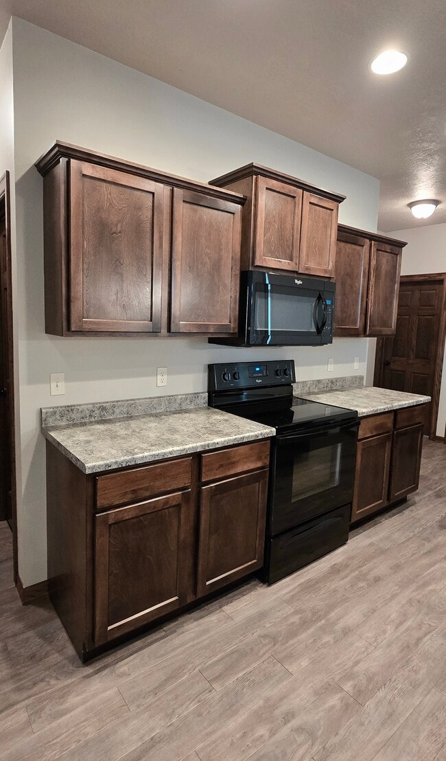 Custom millwork adds an upgraded touch to your open kitchen. - 3511 E Bison Trl