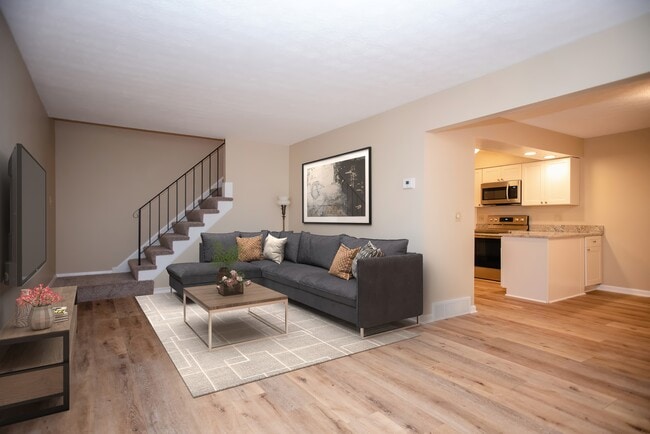 Luxury vinyl plank flooring flows through the main floor. - 837 Tollis Pkwy
