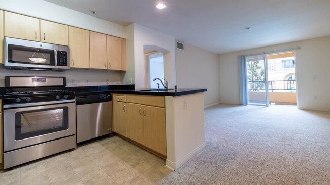 Carpeted Living Room with Balcony - Westside