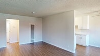 Located at 2376 Fairfield Ave in Fairfield, California, this single-story, one-bedroom, one-bathroom unit offers a well-organized layout across a comfortable footprint. The open living room is bright and airy, featuring warm hardwood-style flooring, a textured ceiling, a wall-mounted mini-split system for climate control, and sliding glass doors that lead to a private balcony with outdoor views — filling the space with abundant natural light.

The galley-style kitchen is efficiently designed with white cabinetry, light quartz countertops, a stainless steel gas range, microwave, refrigerator, and a single-basin sink, making excellent use of its streamlined layout.

The generously sized primary bedroom features dual mirrored sliding closet doors, hardwood-style flooring, a textured ceiling, and a window that welcomes natural light. A connecting hallway links the bedroom to the rest of the unit, providing a natural sense of flow throughout.

The bathroom is clean and bright, appointed with a white vanity, quartz countertop, a full tub-shower combo with white tile surround, and a window for natural ventilation. Throughout the unit, neutral tones and consistent flooring create a cohesive, inviting ambiance ideal for comfortable everyday living.