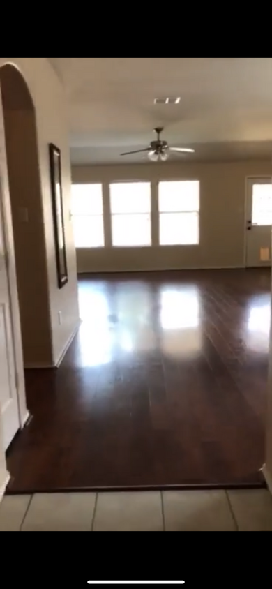 Open floor plan with living room, dining and kitchen flow and connected. Wood floor. - 3516 Lake Hill Ln
